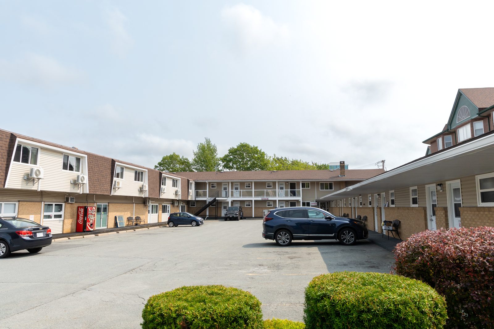 The long line of Bedford motel rooms on a summer day